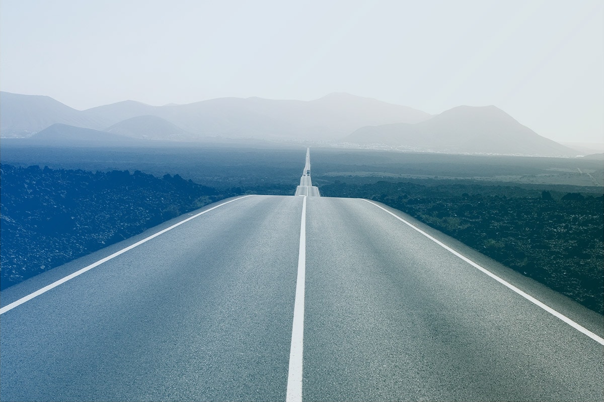 Remote two lane road extending out to the horizon